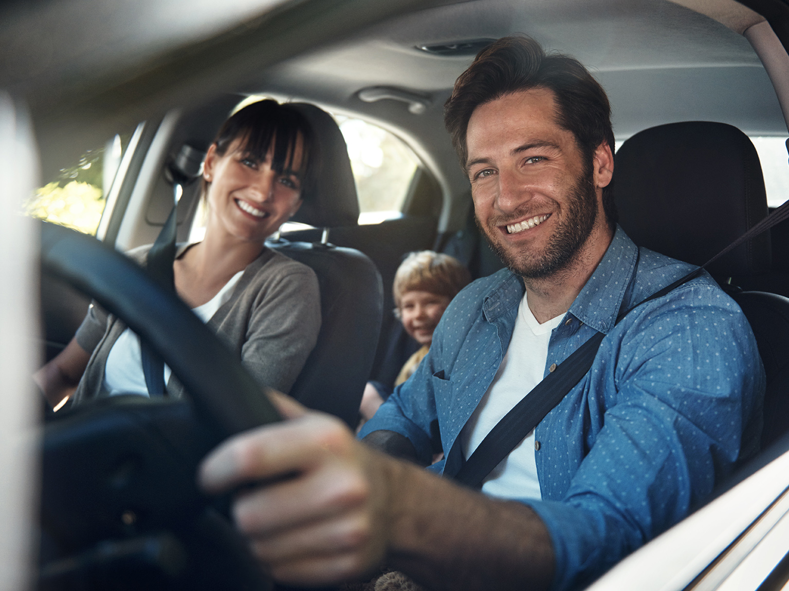 Happy Family In A Safe Vehicle